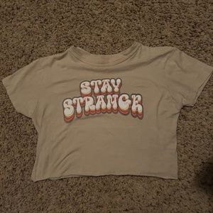 “stay strange” t shirt